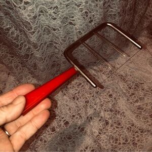 Retro Red Handled Bakelite cheese cutter from the early 40s, a great collectible